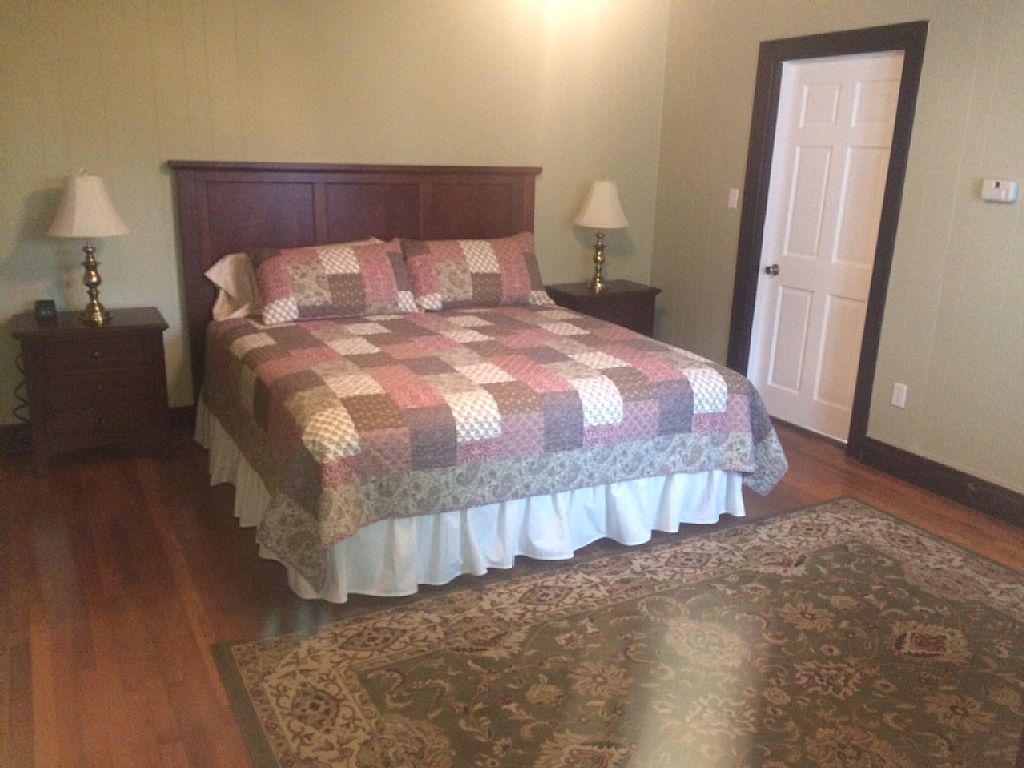 Master bedroom on first floor with king size bed