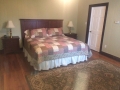 Master bedroom on first floor with king size bed